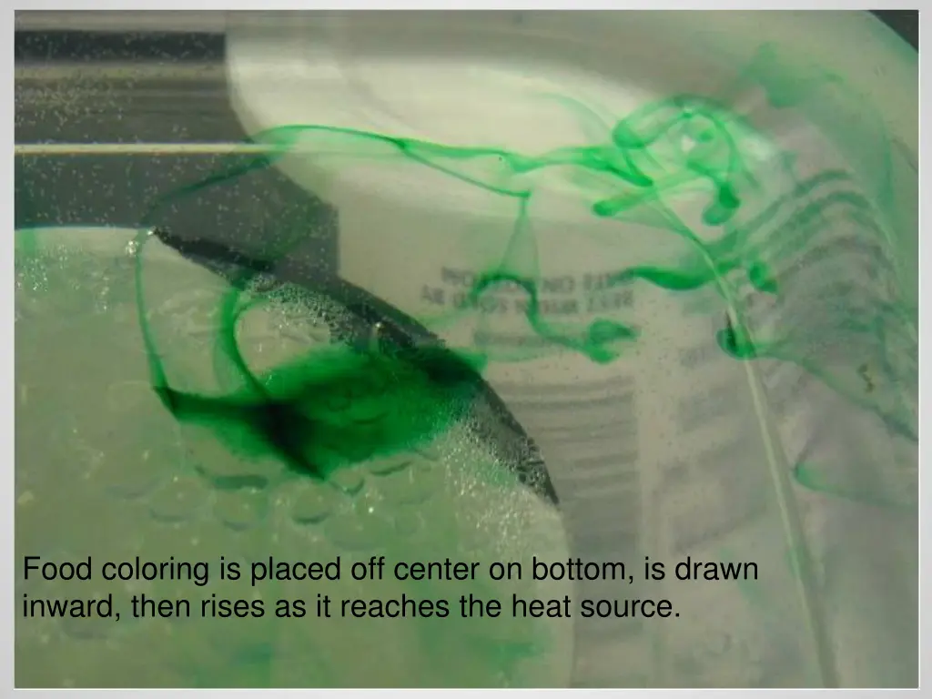 food coloring is placed off center on bottom