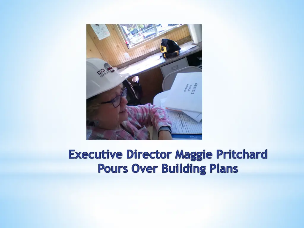 executive director maggie pritchard pours over