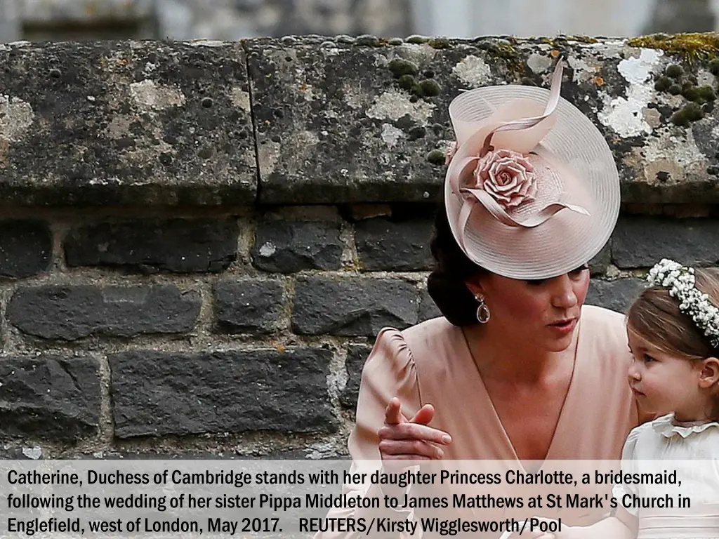 catherine duchess of cambridge stands with