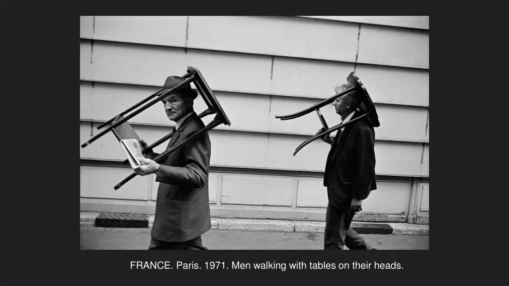 france paris 1971 men walking with tables