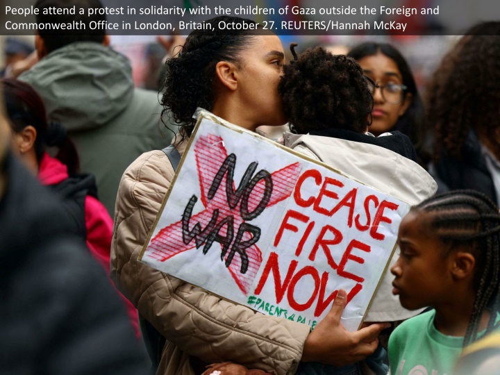 people attend a protest in solidarity with