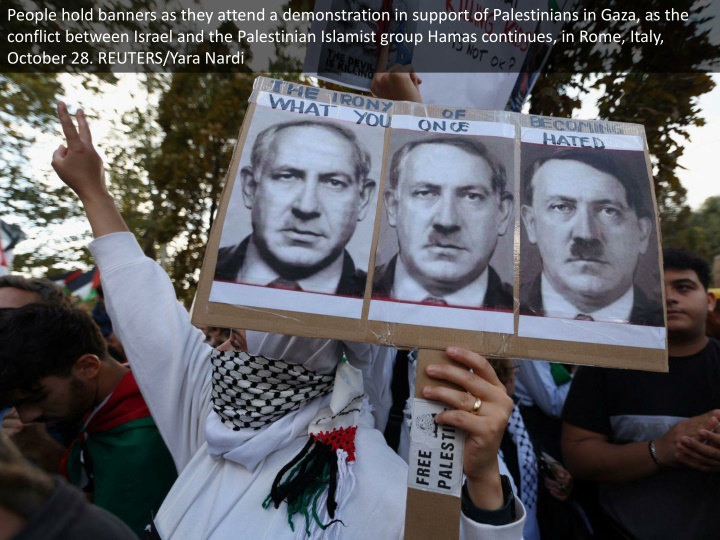 people hold banners as they attend